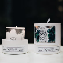 Load image into Gallery viewer, Ame fauve scented candle in white cylindrical packaging with a tiger in the jungle