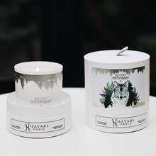 Load image into Gallery viewer, secret mystique scented candle in white cylindrical packaging with a wolf in the forest