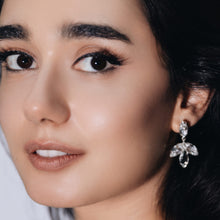 Load image into Gallery viewer, flower petal pendant earrings in silver and clear crystals