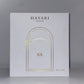 White box with gold engraving of Hayari doors 
