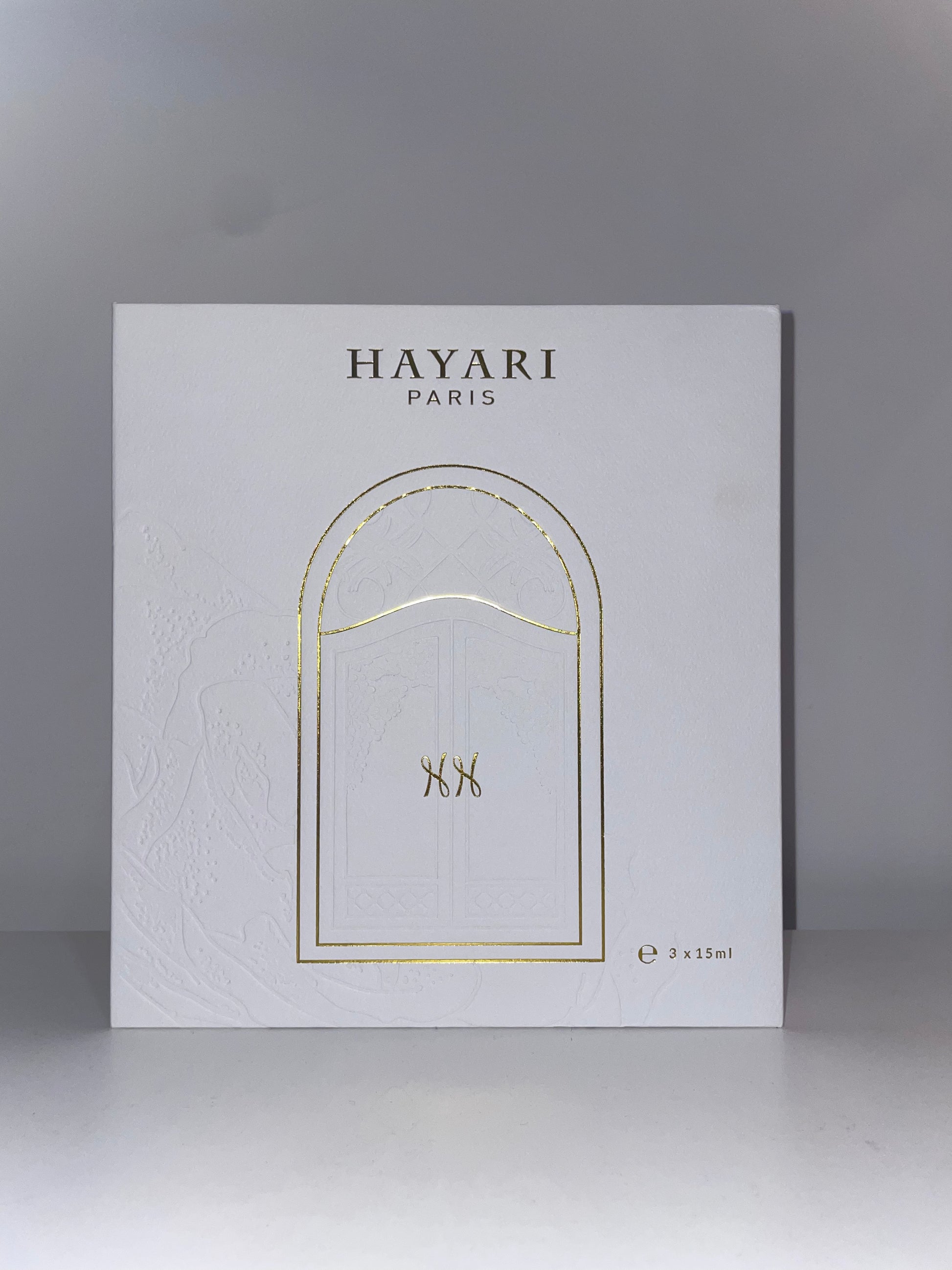 White box with gold engraving of Hayari doors 