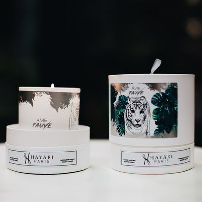 Ame fauve scented candle in white cylindrical packaging with a tiger in the jungle