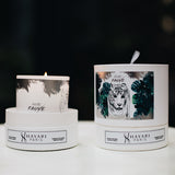 Ame fauve scented candle in white cylindrical packaging with a tiger in the jungle