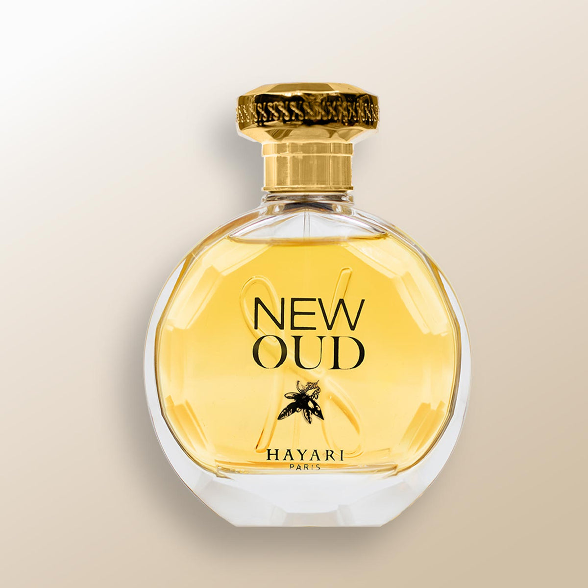 new oud eau de parfum, clear round bottle with a gold juice perfume and a gold cap. 