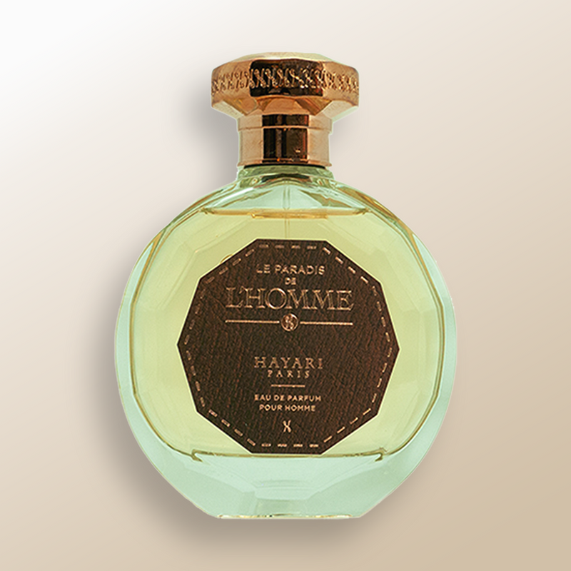 Men perfume with transparent bottle and green perfume juice. a gold cap and an imitation leather sticker with the name of the fragrance.