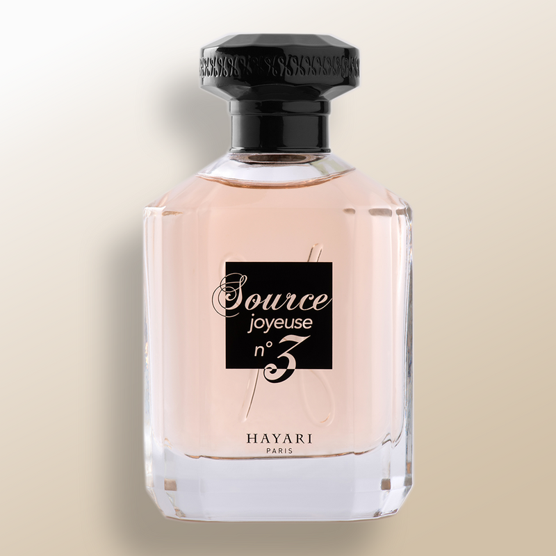 Source joyeuse n°3 eau de parfum in a clear bottle with black elements. Pink juice perfume
