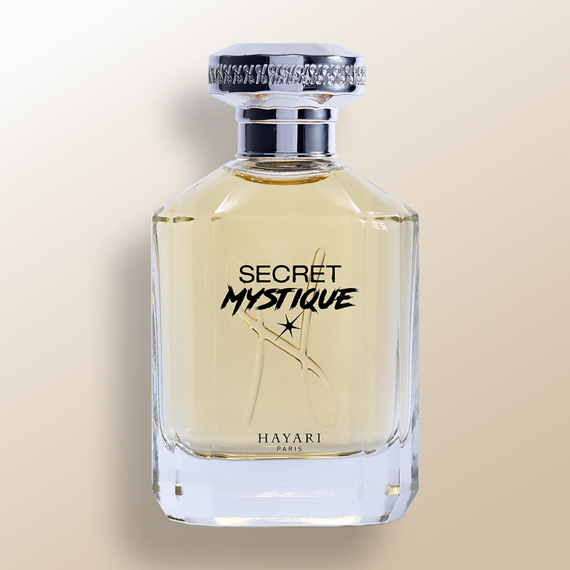 Eau de parfum "secret mystique" with a clear rectangular bottle and silver cap